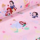 Tissu Coton imprimé sous licence Bio Princesses Disney sur fond Rose - Par 10 cm