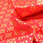 Tissu Coton imprimé Bio Beaux flocons dorés sur fond Rouge