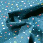 Tissu Coton MC Fabrics Petites étoiles multicolores sur fond Bleu pétrole