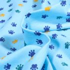 Tissu Jersey Coton Pattes de chiens sur fond Bleu turquoise