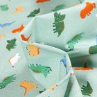 Tissu Coton imprimé Chally Dino multicolores sur fond Vert menthe clair