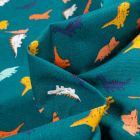 Tissu Coton imprimé Chally Dino multicolores sur fond Bleu pétrole
