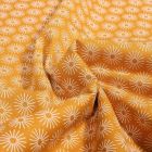 Tissu Coton imprimé Soleils stylisés sur fond Ocre - Par 10 cm
