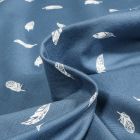 Tissu Jersey Coton Plumes blanches sur fond Bleu denim