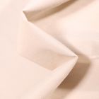 Tissu Simili cuir d'habillement Petits points brillants sur fond Blanc cassé