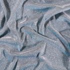 Tissu Jersey Lurex Pailleté sur fond Givre reflets bleus - Par 10 cm