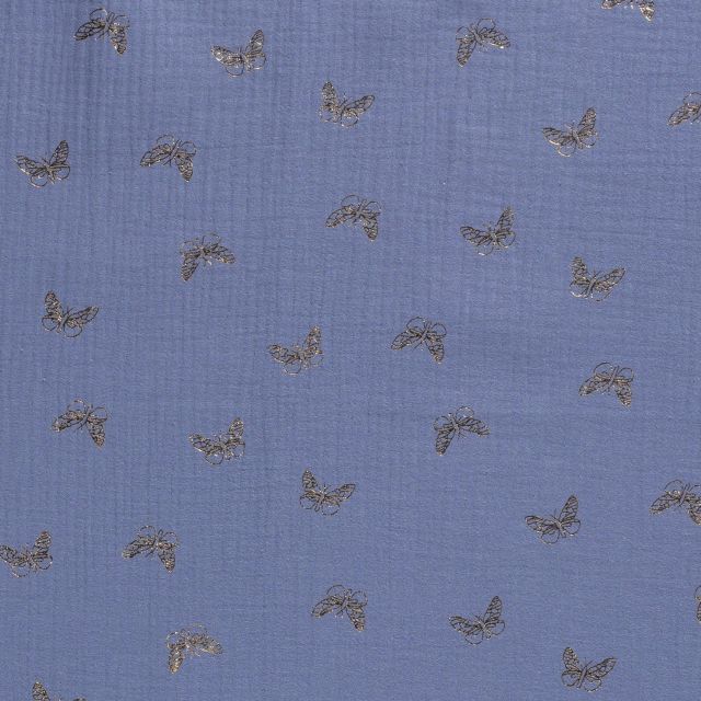 Tissu Double gaze de coton Papillons métallisé doré sur fond Bleu denim - Par 10 cm