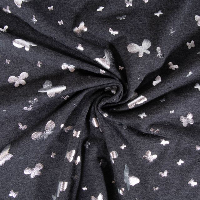 Tissu Jersey Coton Papillons métalissés sur fond Gris clair chiné