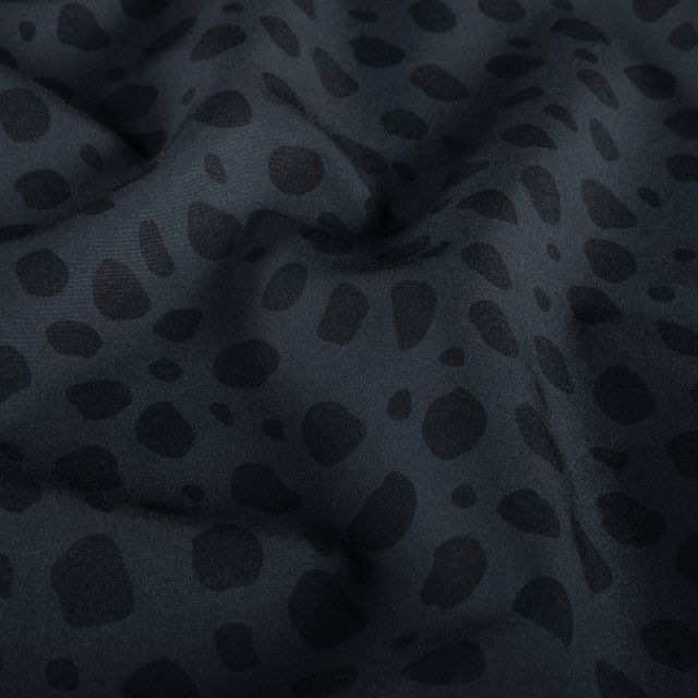Tissu Softshell  Naya léopard Noir sur fond Gris