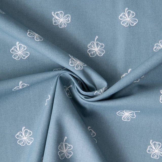 Tissu Popeline de Coton Clovers blancs sur fond Bleu