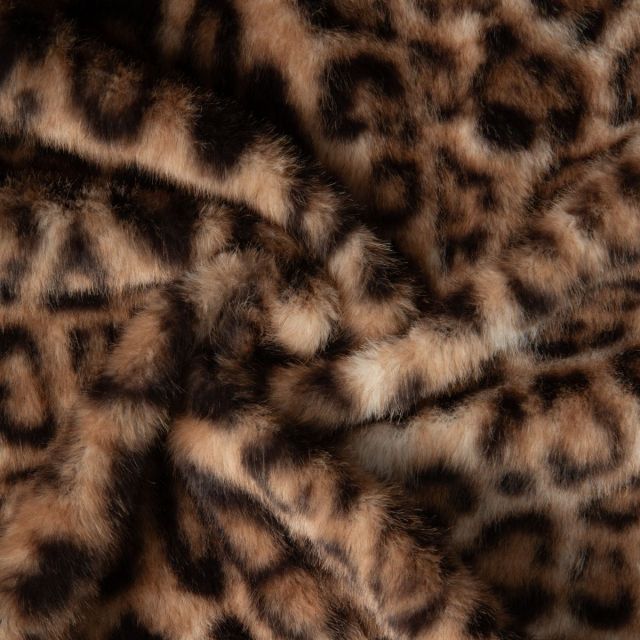 Tissu Fausse fourrure long poil Panthère noir sur fond Marron