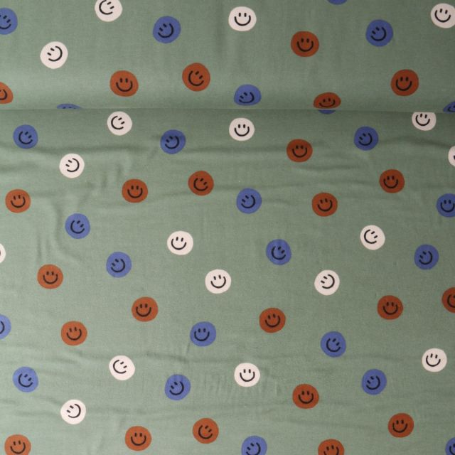 Tissu Flanelle de Coton Zoé smiley Bleu sur fond Vert olive