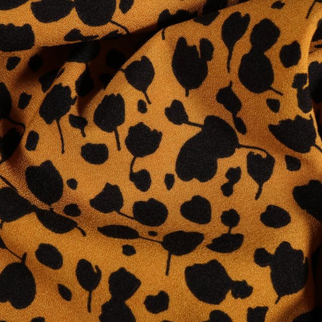 Tissu Crêpe stretch Tulipes noires sur fond Jaune - Par 10 cm