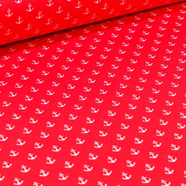 Tissu Coton enduit Ancres blanches sur fond Rouge