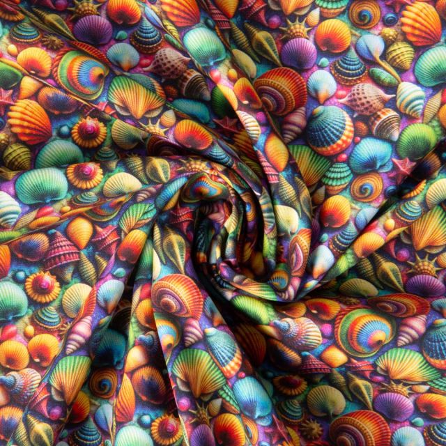 Tissu Coton imprimé Coquillage arc en ciel sur fond Violet