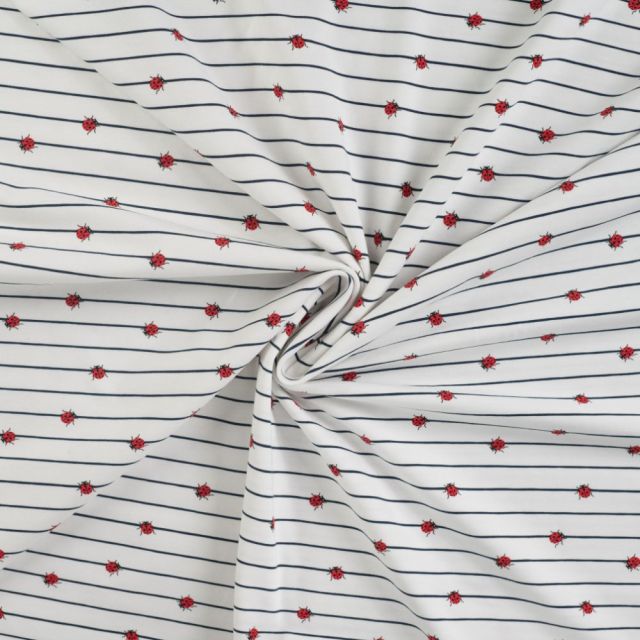 Tissu Jersey Coton Rayures bleues et coccinelles sur fond Blanc