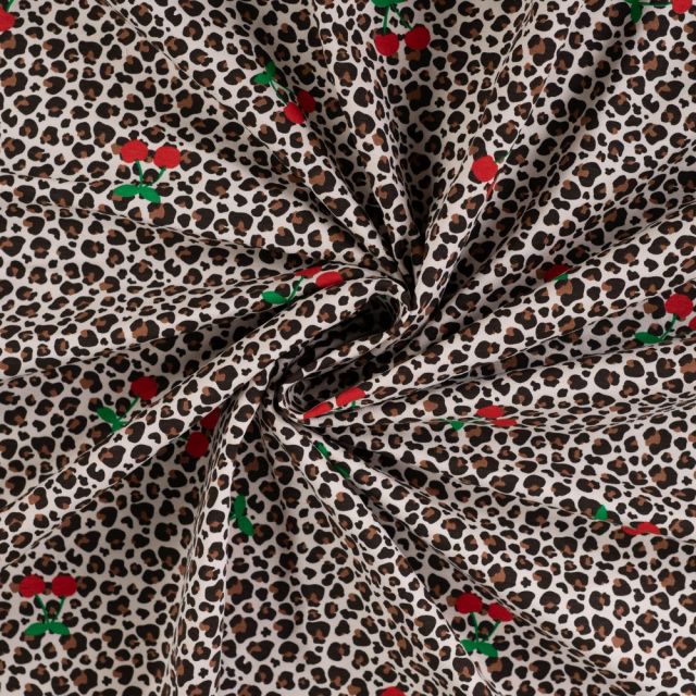 Tissus Jersey Coton imprimé Cerises et léopard sur fond Ecru