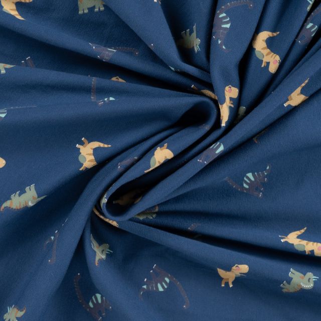 Tissu Jersey Coton imprimé Noé gentils dinosaures sur fond Bleu marine