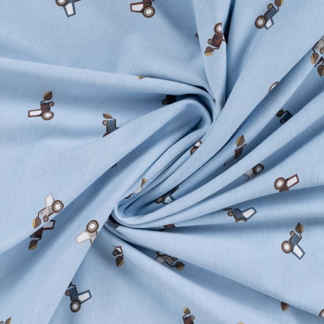Tissu Jersey Coton imprimé Noé petits tracteurs sur fond Bleu ciel
