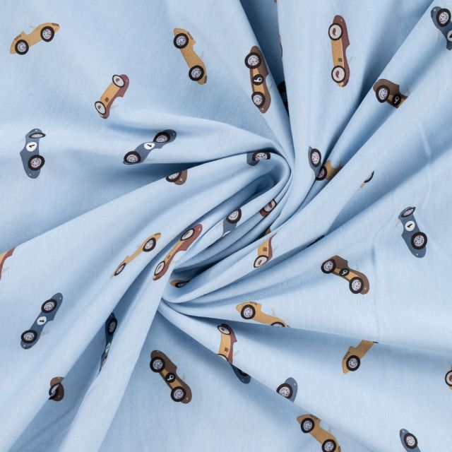 Tissu Jersey Coton imprimé Côme voitures de course sur fond Bleu ciel