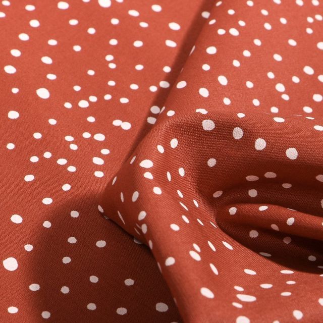 Tissu Coton imprimé Petits pois irréguliers sur fond Brique - Par 10 cm