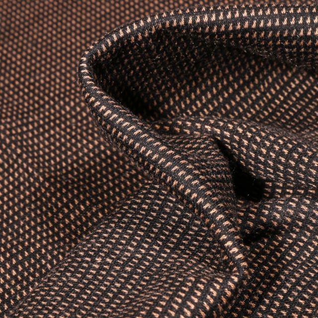 Tissu Jacquard polyviscose extensible Pointillés brique sur fond Noir - Par 10 cm