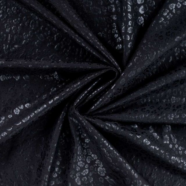 Tissu Simili cuir Naya extensible effet panthère brillant sur fond Noir