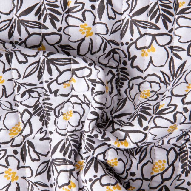 Tissu Coton Matelassé réversible Ray floral Noir et feuillage Jaune sur fond Blanc