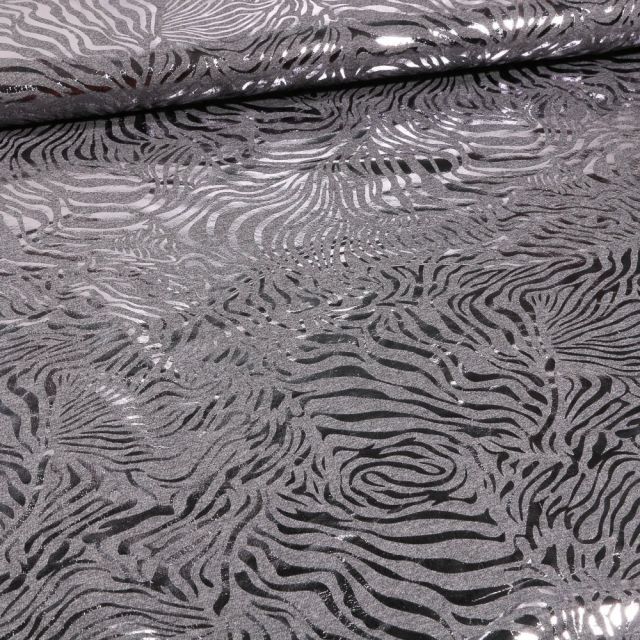 Tissu Jersey Coton zébré métallisé sur fond Gris chiné - Par 10 cm