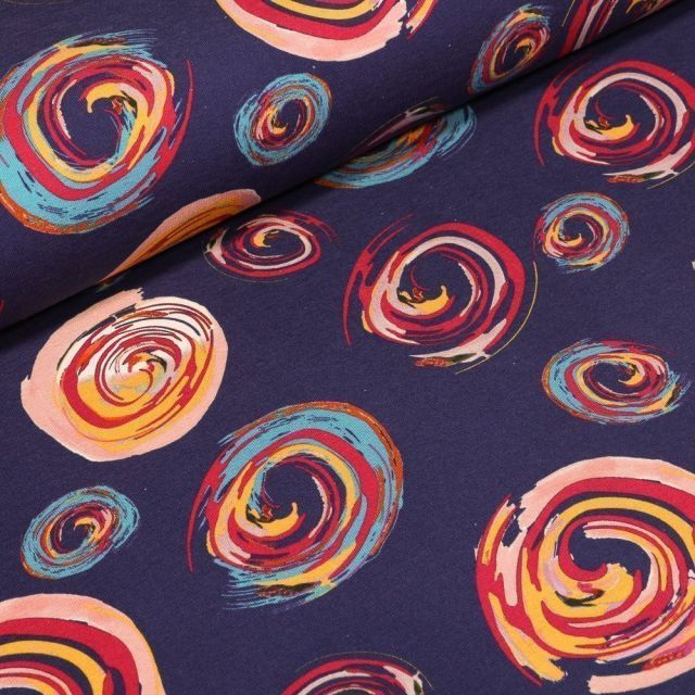 Tissu Jersey Coton Spirales colorées sur fond Bleu marine - Par 10 cm