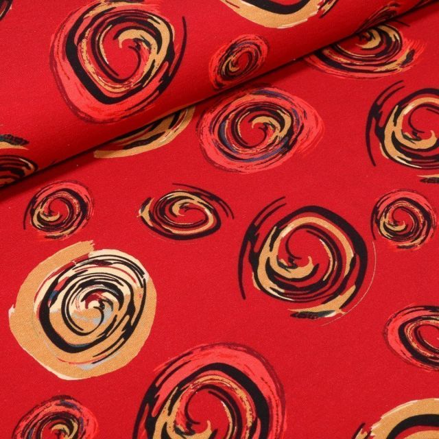 Tissu Jersey Coton Spirales colorées sur fond Rouge - Par 10 cm