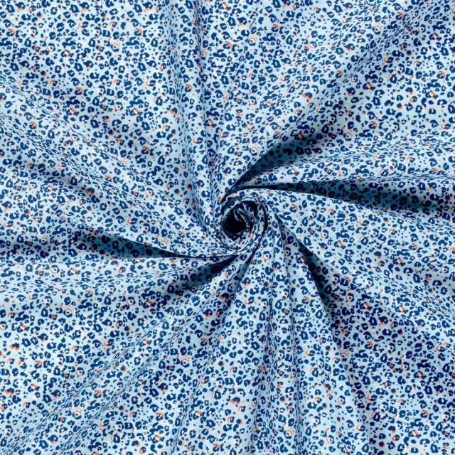 Tissu Popeline de Coton panthère Nyra sur fond Bleu ciel - Par 10 cm