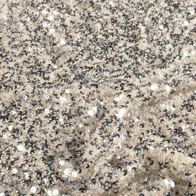 Tissu Sequins Cosmos sequins Argentés sur fond Beige nacré
