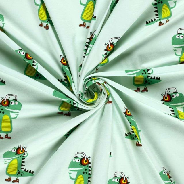 Tissu Jersey Coton imprimé Dino stylé sur fond Vert menthe