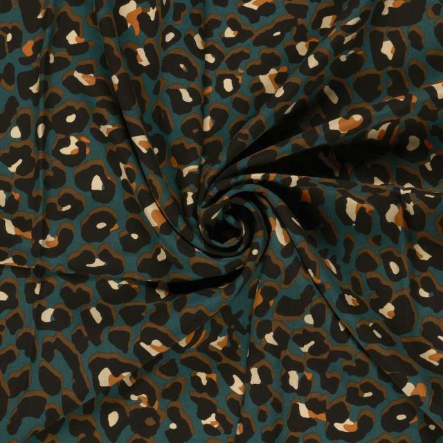 Tissu Popeline de Viscose Zahia léopard Noir sur fond Bleu canard