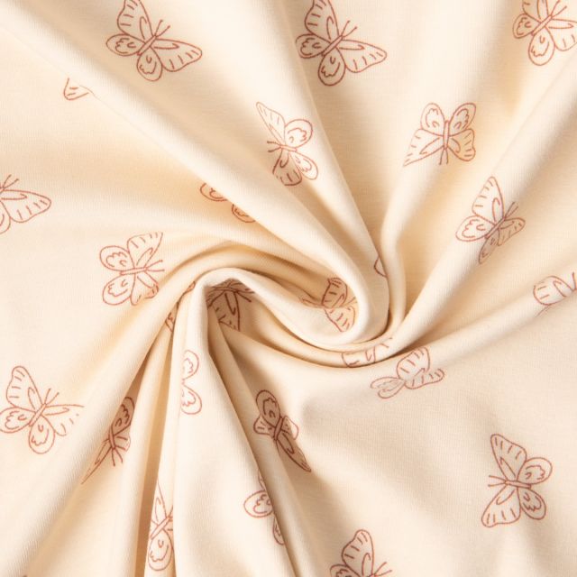 Tissu Jersey Coton imprimé Iris papillons Terracota sur fond Beige