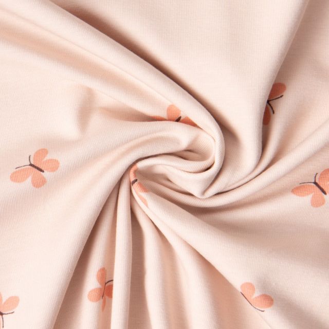 Tissu Jersey Coton imprimé Iris papillons Saumon sur fond Rose pastel