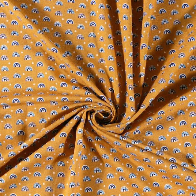 Tissu Jersey Coton imprimé Arc en ciel sur fond Ocre - Par 10 cm