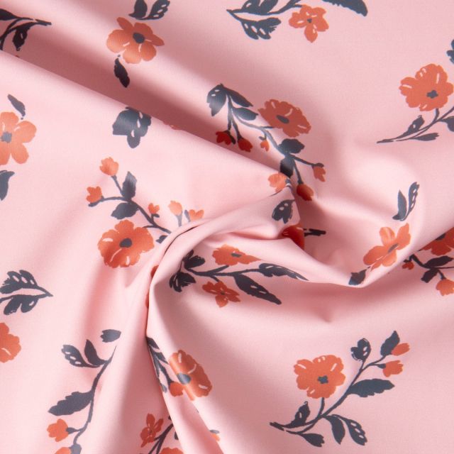 Tissu Imperméable imprimé Fleuris Caseille sur fond Rose pâle