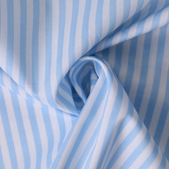 Tissu Coton imprimé  rayé Lisalou sur fond Bleu layette