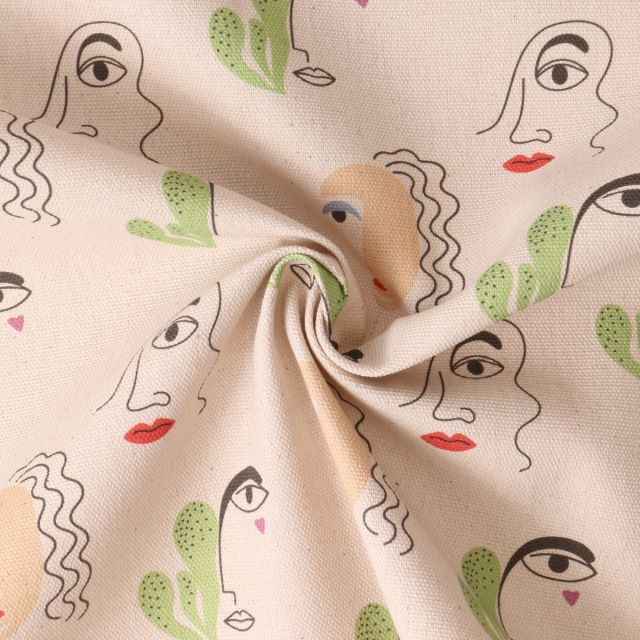 Tissu coton imprimé Cielo Dessin visages sur fond Beige
