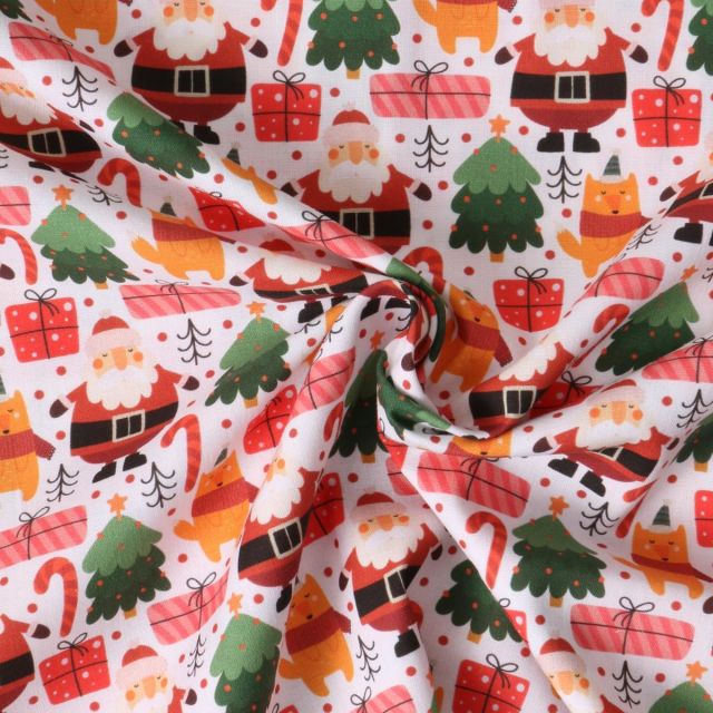 Tissu Coton imprimé  Néola pères Noël Rouges sur fond Blanc
