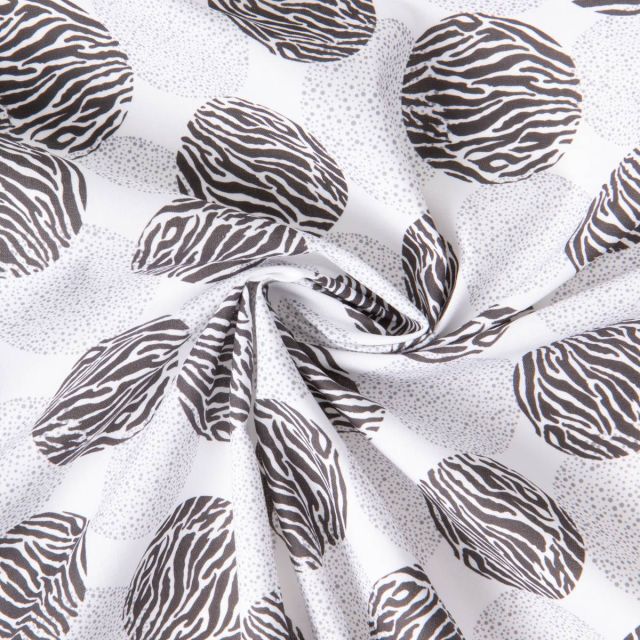 Tissu Coton imprimé Ronds zébrés sur fond Blanc