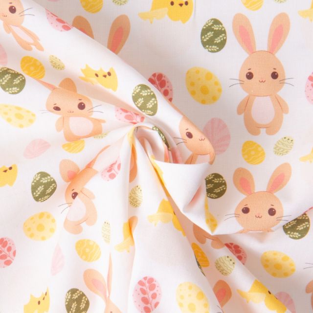 Tissu Coton imprimé Lapins et oeufs de Pâques sur fond Blanc