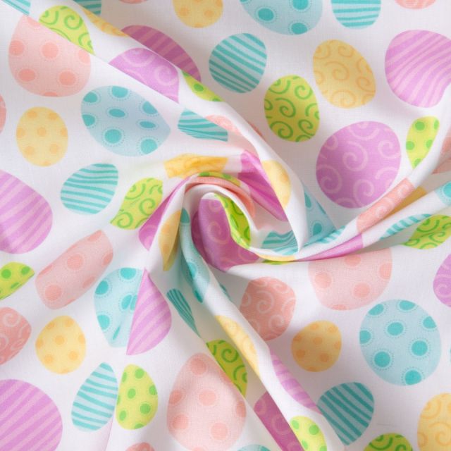 Tissu Coton imprimé Oeufs de Pâques colorés sur fond Blanc