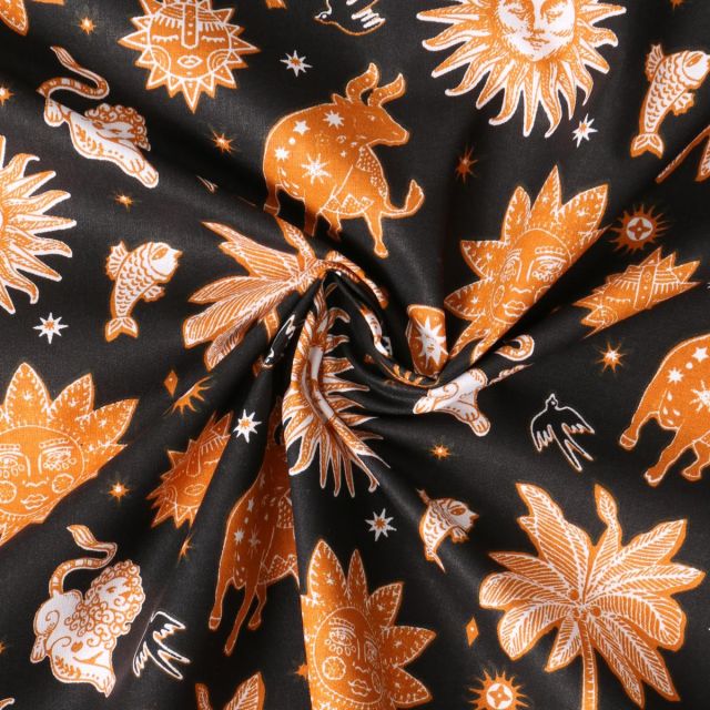 Tissu Popeline de Coton  Cassiopée motif cosmique Ocre intense sur fond Noir profond