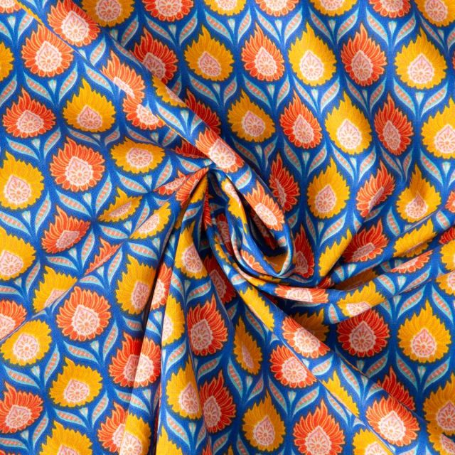 Tissu Coton imprimé Arty Luka jaune orangé sur fond Bleu roi