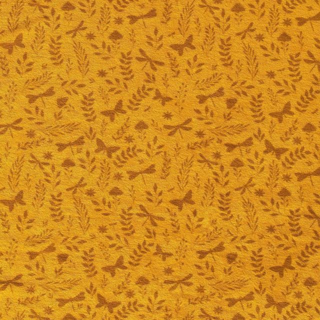 Tissu Jersey Velours Eponge Libellules papillons et feuilles sur fond Moutarde - Par 10 cm