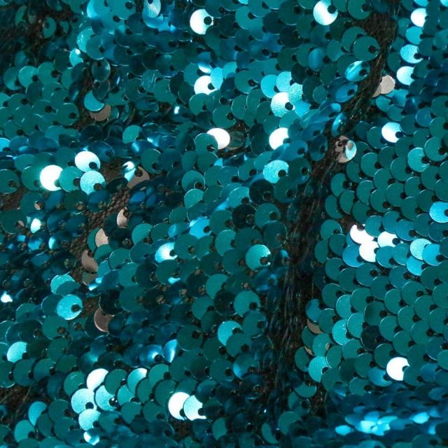 Tissu Sequins réversible argent sur fond Bleu - Par 10 cm