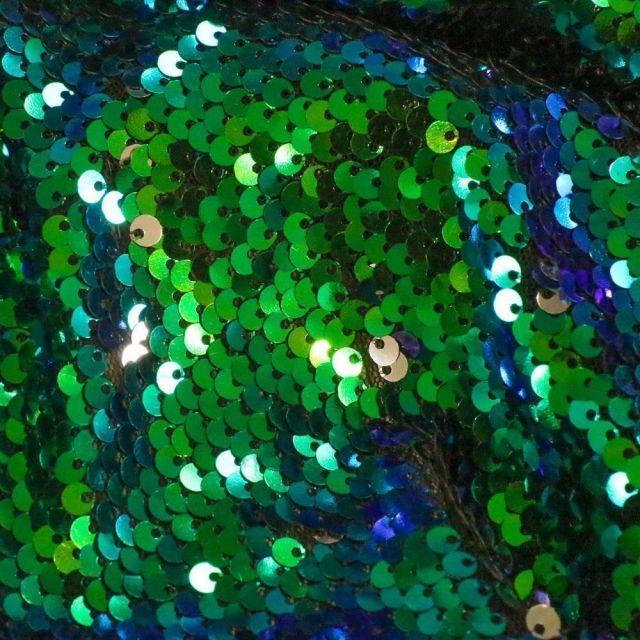 Tissu Sequins réversible bleu et argent sur fond Vert - Par 10 cm